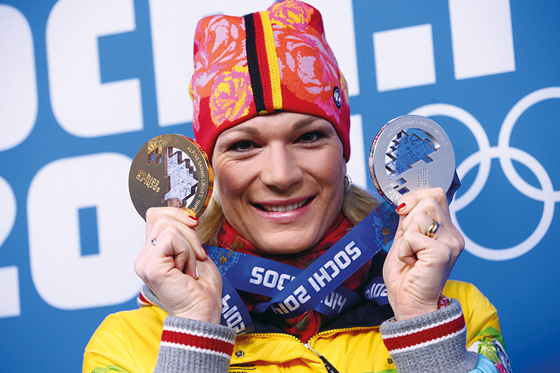 Silver medalist Maria Hoefl-Riesch of Germany, poses with her medal for Super-G (R) and her gold medal of the Women's Ski alpine Women's Super Combined during the medal ceremony of the Women's Super-G Alpine Skiing competition at the Sochi 2014 Olympic Games, Sochi, Russia, 15 February 2014. Photo: Christian Charisius/dpa